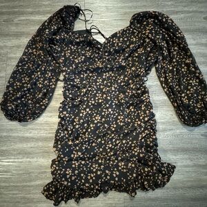 Open back mid length dress, brand All In Favor from Francesca’s Boutique.